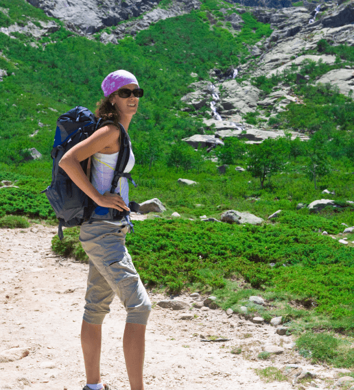 Hiker approaching the Mount Toubkal summit at sunrise