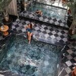 http://Guest%20relaxing%20inside%20a%20traditional%20Moroccan%20Riad%20Pool%20as%20part%20of%20a%20Moroccan%20wellness%20experience