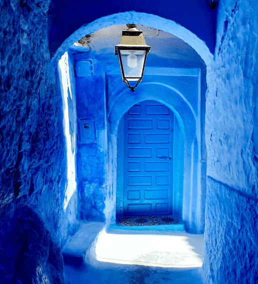 Traditional blue door in Chefchaouen seen during Tailor Made Tours Morocco